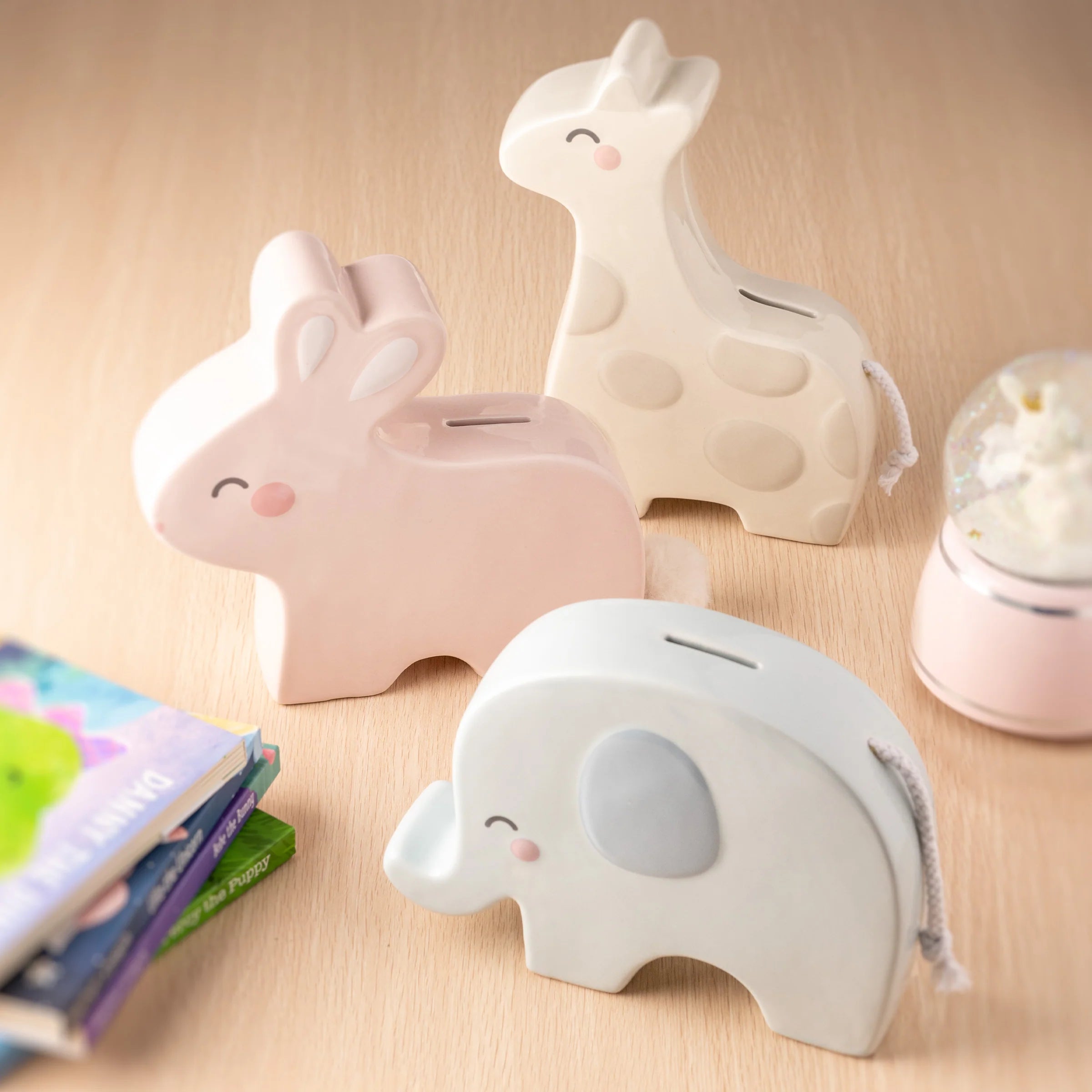 Banks & snow globes designed to delight—fun, thoughtful gifts and decor pieces for kids, collectors, and anyone who loves timeless charm.