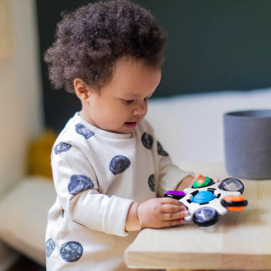 Jouet sensoriel Baby Einstein - Curiosity Clutch