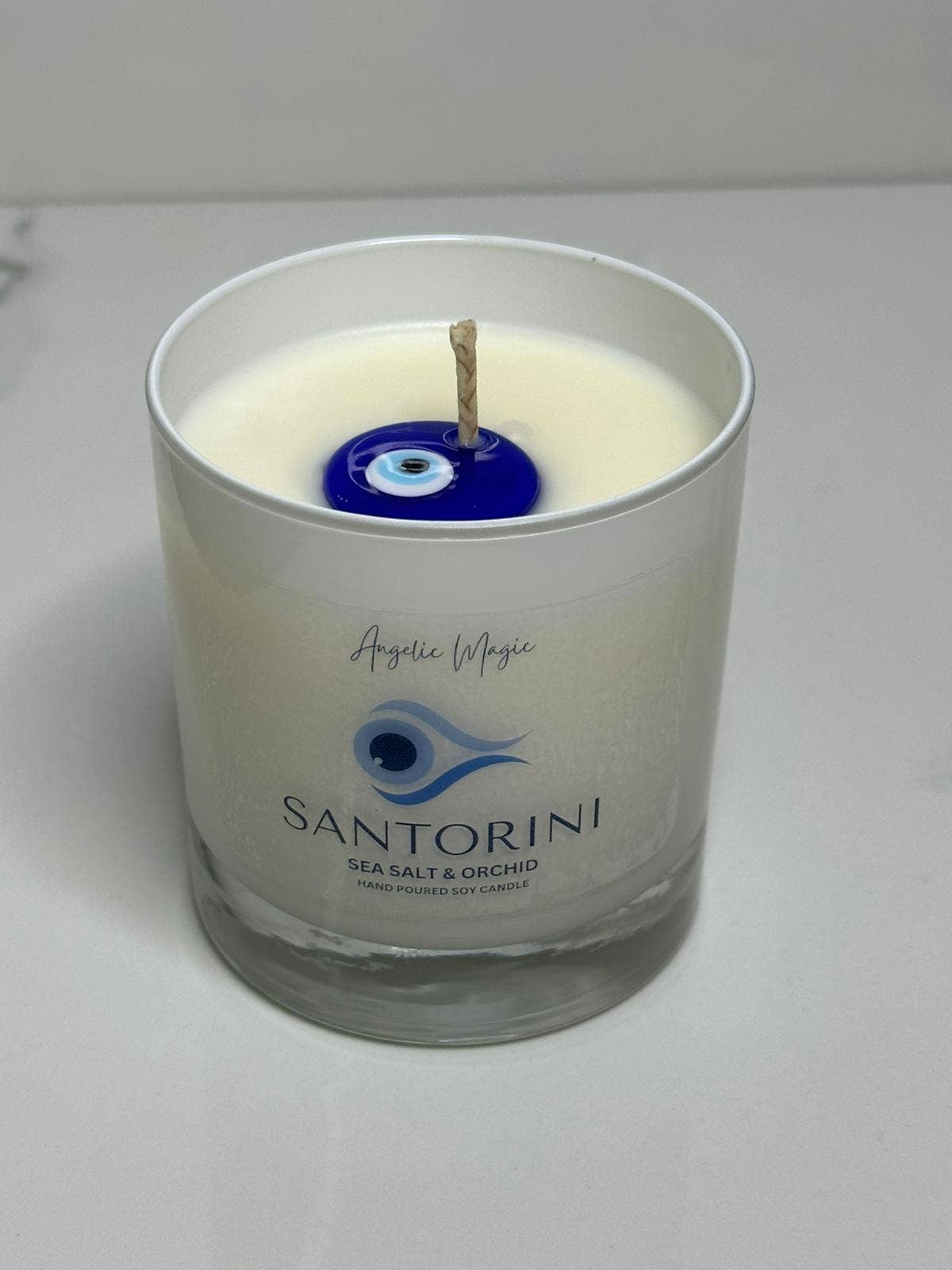 Evil eye Santorini candle (Egyptian Amber)