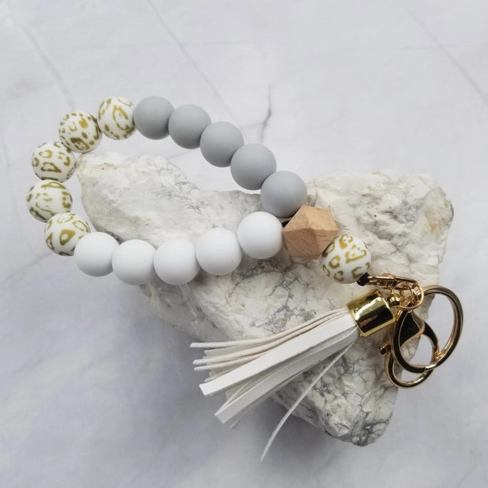 Bracelet en silicone avec porte-clés et perles camouflage dorées