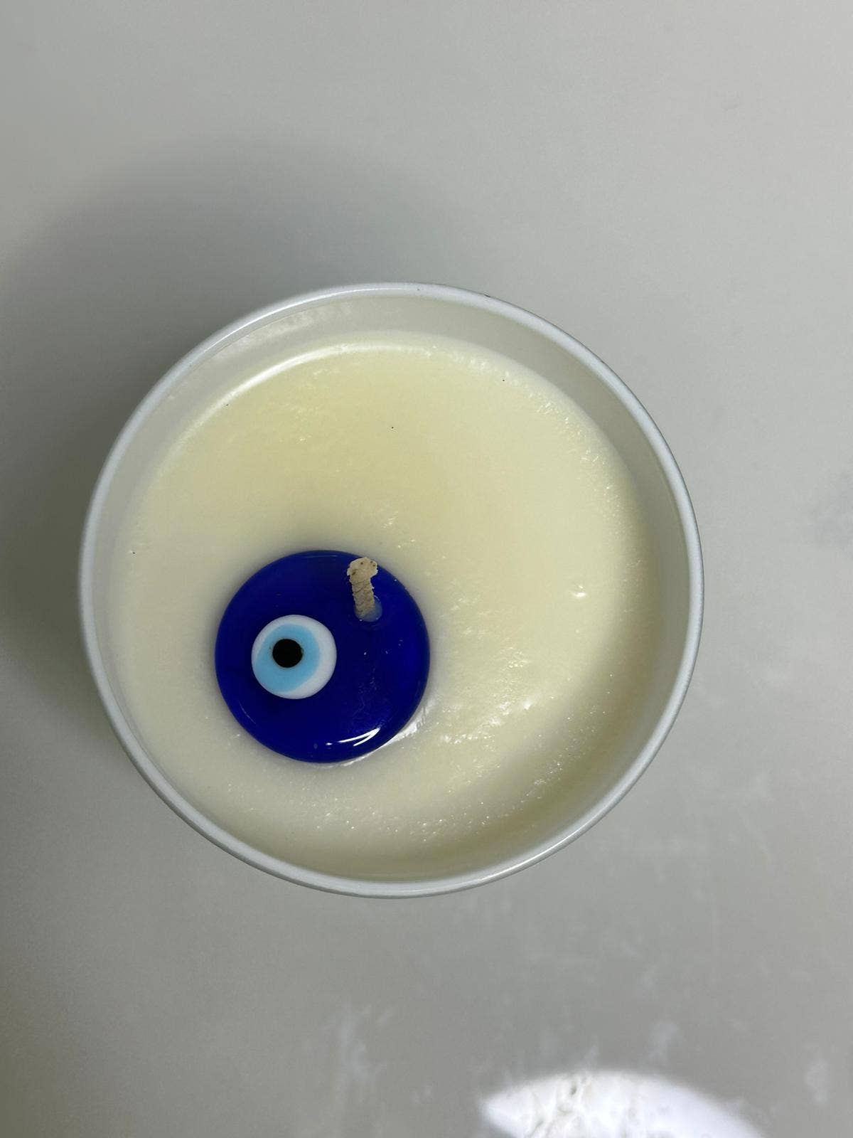 Evil eye Santorini candle (Egyptian Amber)