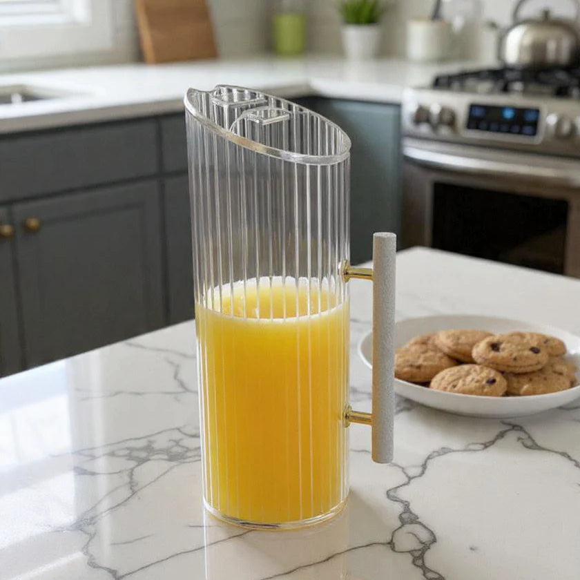 Corrugated lucite pitcher with white leatherette handle