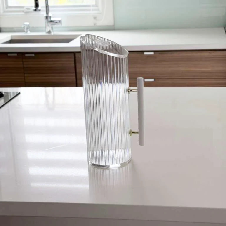 Corrugated lucite pitcher with white leatherette handle