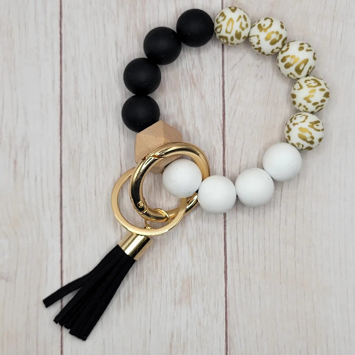 Porte-clés en silicone noir/blanc motif léopard doré