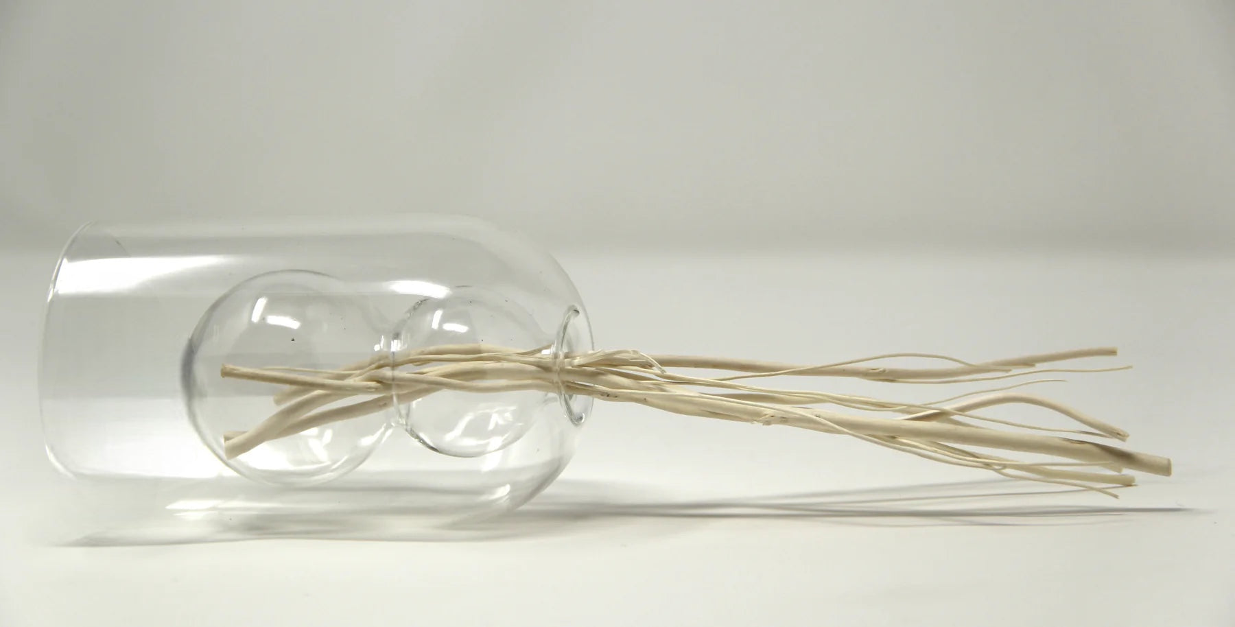 Diffuseur de roseaux transparent avec incrustation circulaire blanche - Parfum Muguet