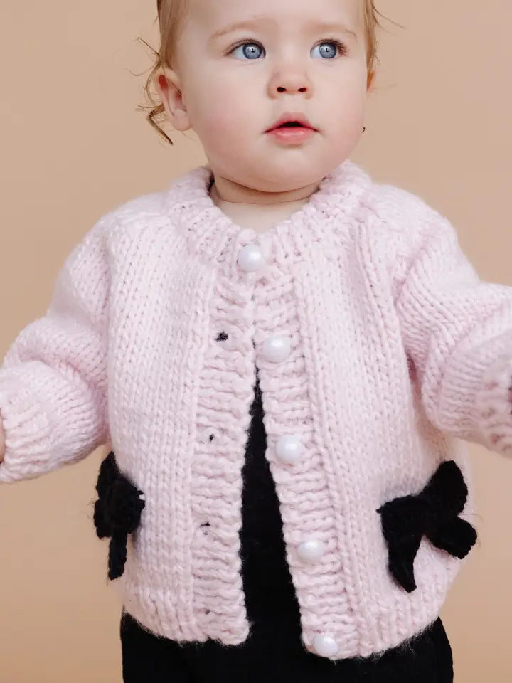 Cardigan rose et noir avec nœud pour bébé