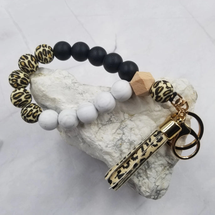 Bracelet porte-clés en silicone avec perles léopard blanches