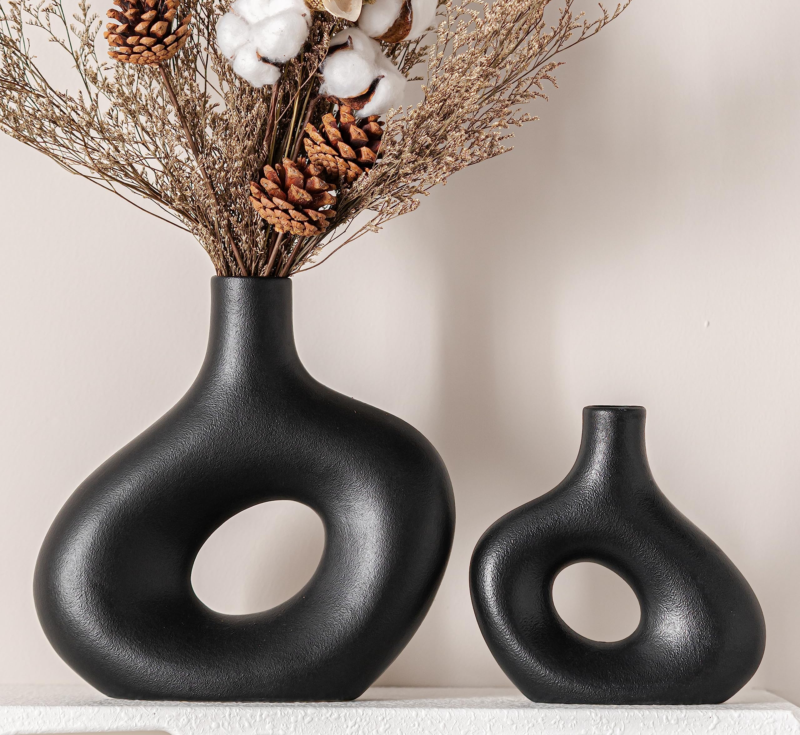 set of 2 black ceramic hollow vases