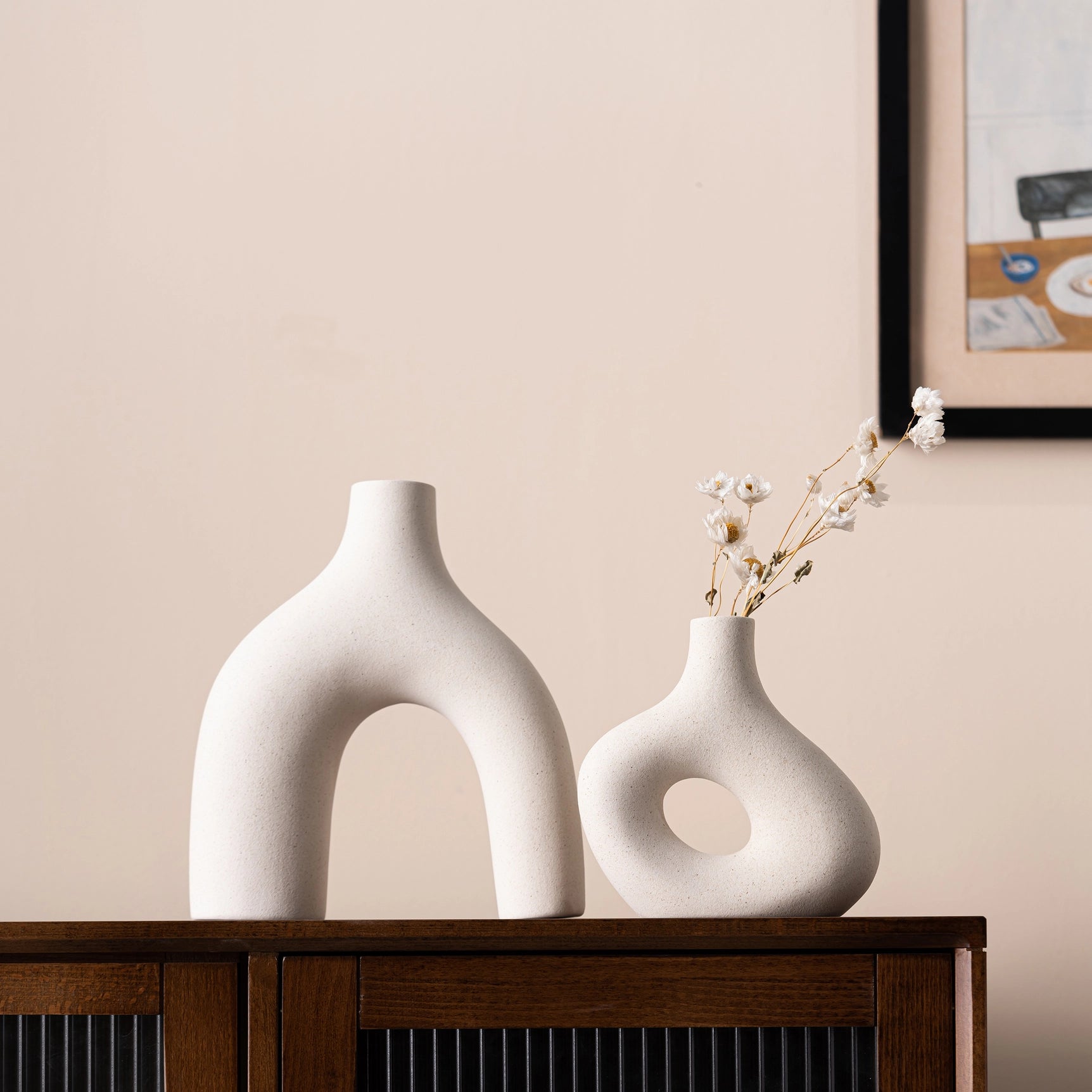 set of 2 off white ceramic curved vases