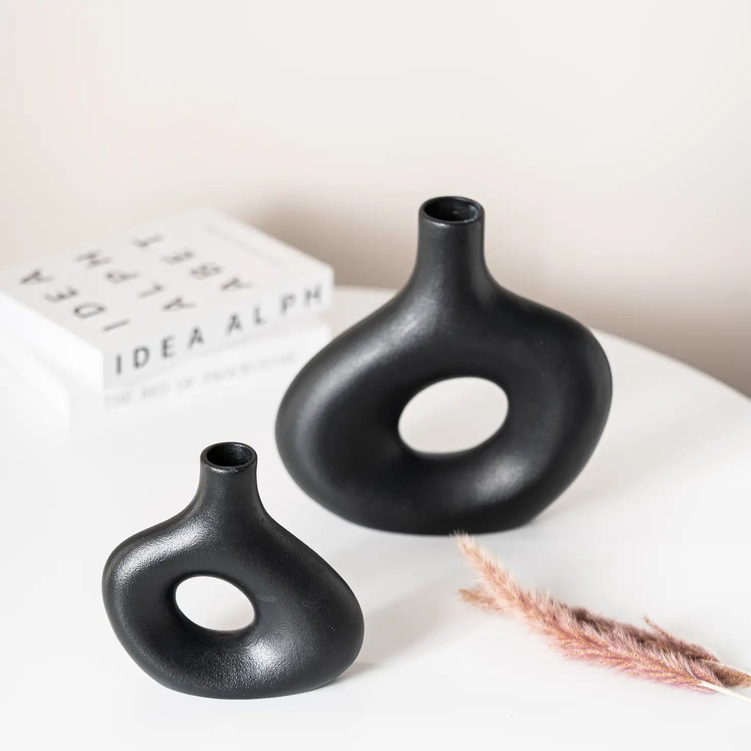 set of 2 black ceramic hollow vases